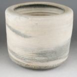 Lucie Rie (1902-1995) A cylindrical stoneware pot circa 1958, the natural ground with grey-blue