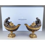 A boxed pair of modern Wedgwood black basalt and gilt "Vestal oil lamp and cover inspired from an