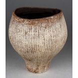 Hans Coper (1920-1981) a small stoneware cup with vertical sgraffito decoration, dark brown glazed