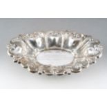 An Edwardian silver shaped oval fruit bowl, with lobed and pierced raised border, with