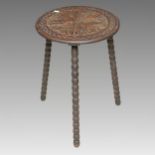 A Liberty style incised oak occasional table on three bobbled supports, approx 44cm diam x 62cm high