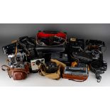 Assorted vintage cased cameras to include Momo, Baby Brownie, Canon FX, Kodak EK160-EF, Hanimex 110,
