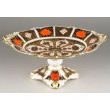 A Royal Crown Derby 1128 Old Imari raised two handled oval comport / fruit bowl, on quatrefoil base,