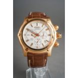 An Ebel '1911' 18ct yellow gold automatic chronograph wristwatch. The circular-shaped dial with