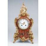 A late 19th century French red and black marble effect gilt metal mounted mantel clock with silvered