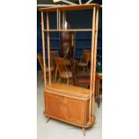 An 86cm approx vintage Ercol light elm 'Giraffe' room divider bookcase with open shelves to top,