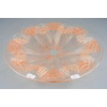 A Lalique clear and orange coloured glass shallow circular dish in the Oeillets pattern, a design of