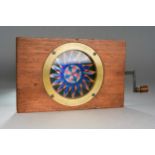 A 19th Century mahogany and brass mounted hand-coloured Chromatrope Magic Lantern "Firework"