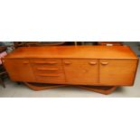 A Val Rossi for Beithcraft Limited teak sideboard, rounded ends, fitted with an arrangement of three