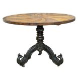 19th century carved Anglo Portuguese ebonised tilt top table with spiralled design specimen wood top