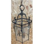 An early 20th century hexagonal hanging hall lantern, with beveled glass panels and a three-light