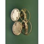 A pair of yellow gold cufflinks. The Hallmarked 9ct gold links each feature a plain engraved oval