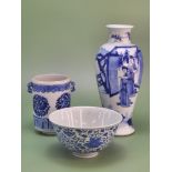 Three Chinese blue and white porcelains, a baluster vase painted with three ladies on a terrace. H
