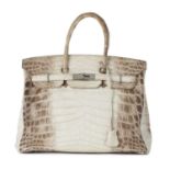 Hermes, a 2010 Matte Himalayan Niloticus Crocodile Birkin 35 handbag.