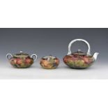 'Pomegranate' a rare Moorcroft Pottery three piece tea set with Shreve & Co silver mount designed by