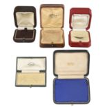 A collection of five antique silk lined jewellery boxes including Tiffany and Co., London; Tiffany