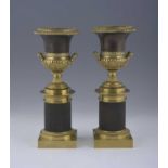 A pair of 'Grand Tour' classical bronze/gilt bronze desk twin-handled campana urns, 19th Century,