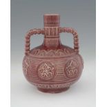 An Aesthetic Movement twin handled faience vase, probably Burmantofts, circa 1880, ovoid bottle form