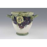William Moorcroft, a large Pansy on White twin handled vase, circa 1914, footed beaker form with