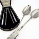 A plated nutcracker and two picks, with a fitted presentation case, together with two plated basting