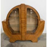A 1930's, Art Deco, walnut display cabinet, with cloud-shaped glazing bar, two internal glass