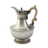 Paul Storr, a George III Regency silver coffee or hot water jug, London 1812, vase-shaped, the lower