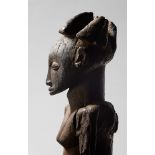 An important seated royal Hemba Singiti Figure