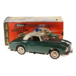 Schuco Elektro Razzia-Car 5509, grün/weiß, Uhrwerk intakt, mit 2 Figuren, LS und Alterungsspuren,