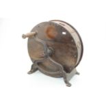 A vintage knife sharpening tool on cast metal base, 40cm tall, 40cm wide. For collection only.