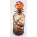 A Mdina art glass decanter, attributed to Eric Dobson with blue swirling decoration, 27cm tall. In