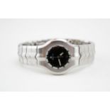 Tag Heuer 100m lady's wristwatch, black dial, date aperture at 6 o'clock, 29mm, working order. In