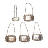 A set of four 20th century silver decanter labels in the George III style, for Brandy, Gin, Vodka