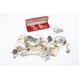 A group of costume jewellery and silver comprising approx 20g of silver rings and necklaces, Miracle