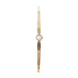 A lady's Omega, 18ct gold and diamond cocktail watch, the signed dial with baton numerals, the