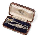 A lady's Art Deco diamond and platinum cocktail watch, by Cyma, the rectangular signed dial with
