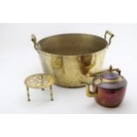 A large brass jampan, 42cm wide, with a brass trivet and copper kettle (3), collection only.