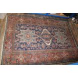 An early 20th century hand-knotted wool carpet of Middle Eastern origin, likely Persian, in