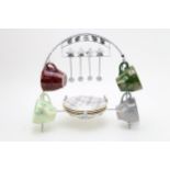 A mid century Brama 'harlequin tea set' comprising four tea cups and saucers with tea spoons on a