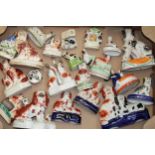 A large collection of Victorian and later Staffordshire dogs to include flatbacks, pen holders and