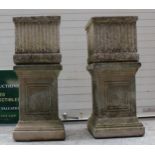A pair of square garden planters on column bases, 65.5cm tall, 25.5cm wide. Frost hardened and