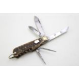 A quality mid 20th century sportsman's bone handle multi tool pocket knife by George Ibberson of