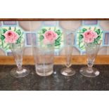 Four antique glasses to include three hand-blown stem glasses with hand engraved decoration,