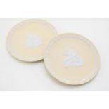 Two Wedgwood yellow Jasperware plates with traditional scenes, 17cm diameter (2). In good