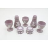 Wedgwood Lilac Jasperware to include three egg cups, a pair of cruets and two small lidded