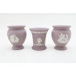 Wedgwood Lilac Jasperware to include a pair of vases and another vase, 10.5cm tall (3). In good