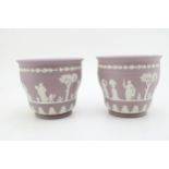 A pair of Wedgwood Lilac Jasperware jardinieres, 11cm tall (2). In good condition with no obvious