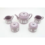 Wedgwood Lilac Jasperware to include a teapot, two lidded sugar jars and two cream jugs (5). In good