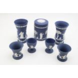 Wedgwood Cobalt Blue Jasperware to include a lidded circular jar, a pair of vases, 11.5cm tall, a