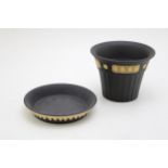 Wedgwood Jasperware jardiniere, 13cm wide, and tray, 14.5cm wide, both yellow relief on black (2).