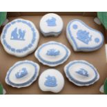 A collection of Wedgwood Blue on White Jasperware trinkets to include a circular example, a love